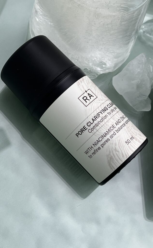 cleanser with niacinamide with ice and turquoise background