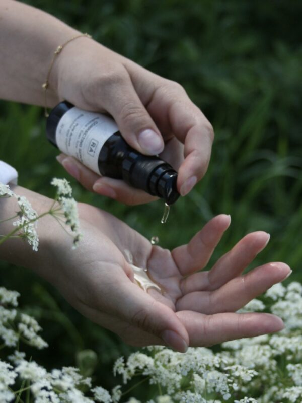 RÅ Skincare correcting serum is pumped in the hand so that you can see the consistency of the product