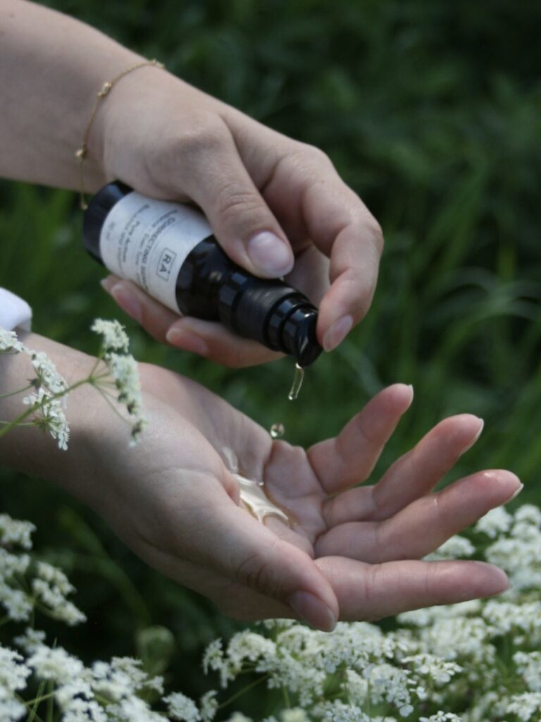 RÅ Skincare correcting serum is pumped in the hand so that you can see the consistency of the product